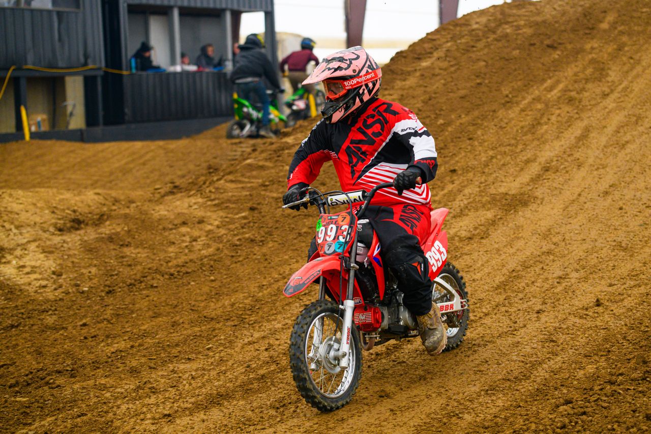 services-04 A thrilling motocross race with dirt bikes speeding on a track in Martinsburg, Ohio.